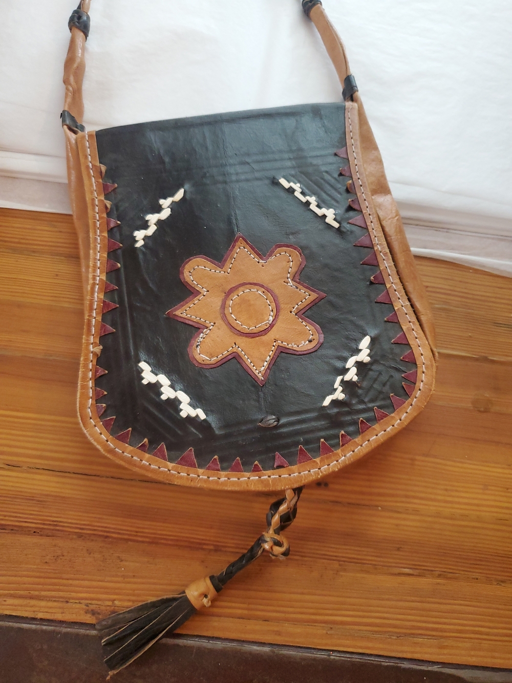 Handcrafted Black and Tan Leather Crossbody Bag with Star Accent